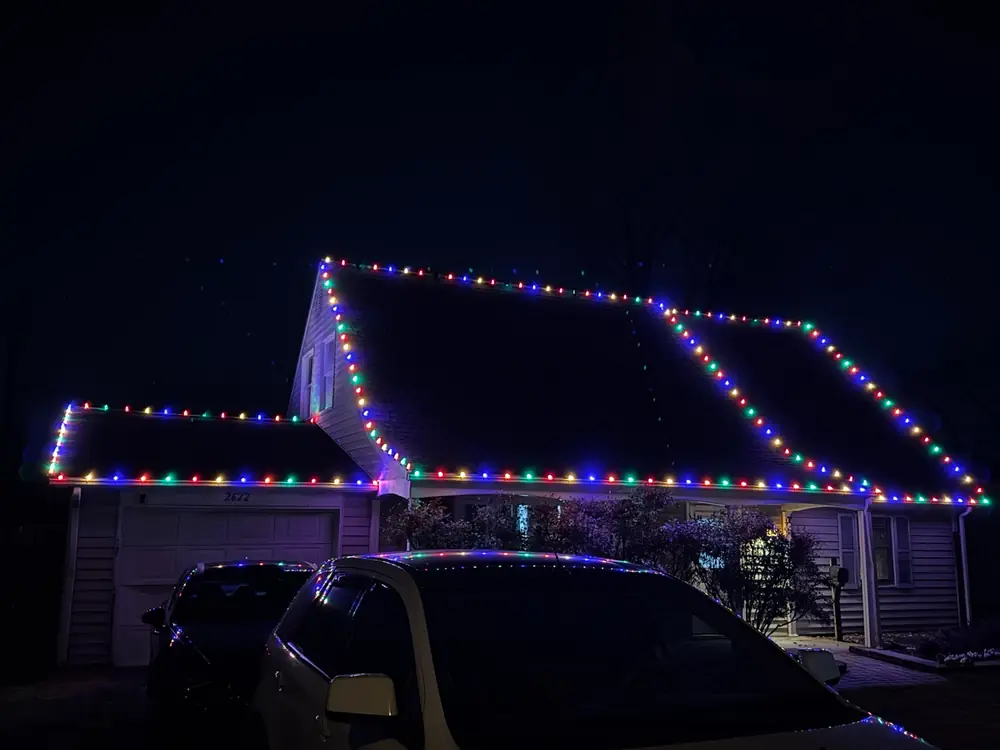 Multicolor lights along a roof at night