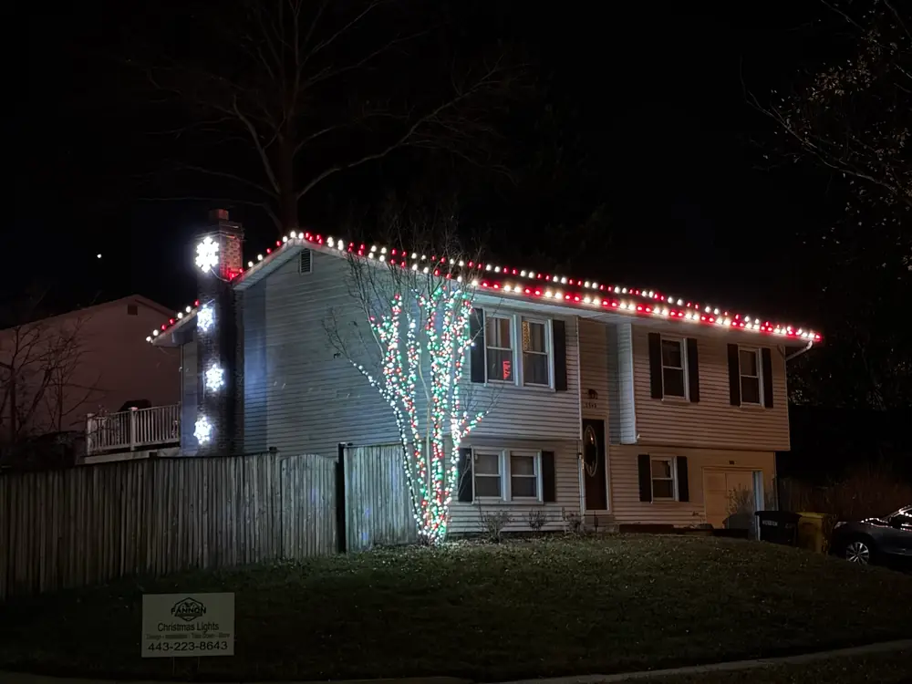 A red and white roofline after dark